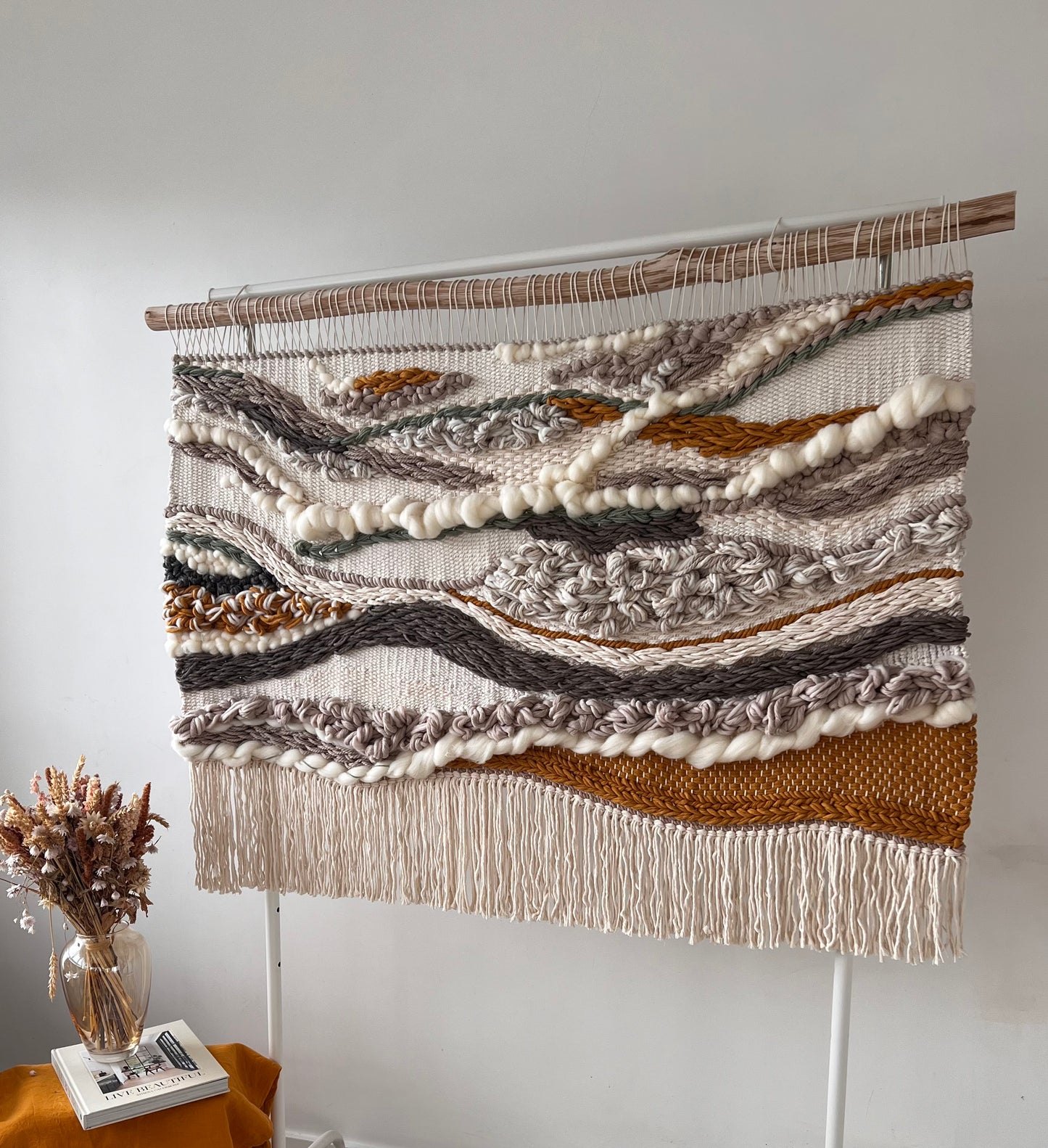 Large 3D wall tapestry on stand shown from the side angle