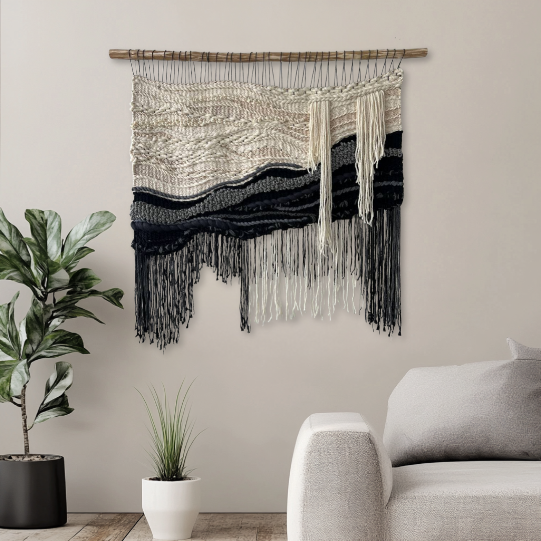 Black and white woven wall hanging as a statement piece in a modern living room interior