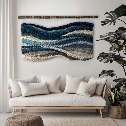 Textured blue wall hanging Glacier Drift displayed above sofa in cozy living room