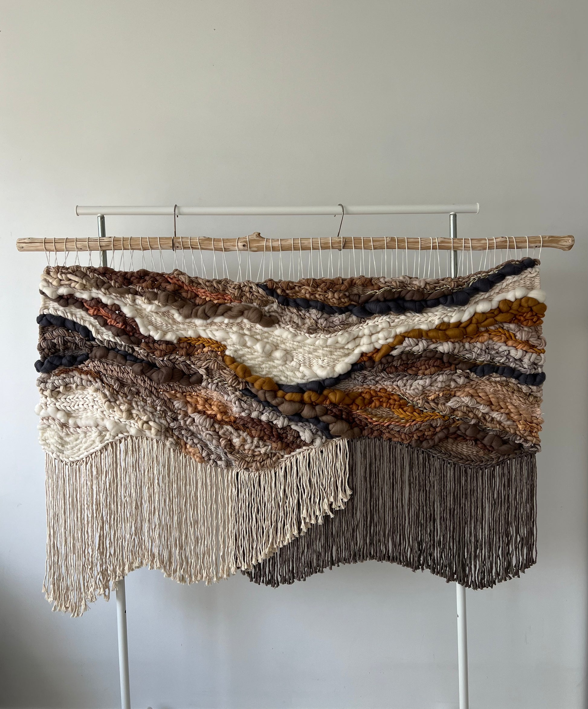 Handmade tapestry with natural earthy color palette