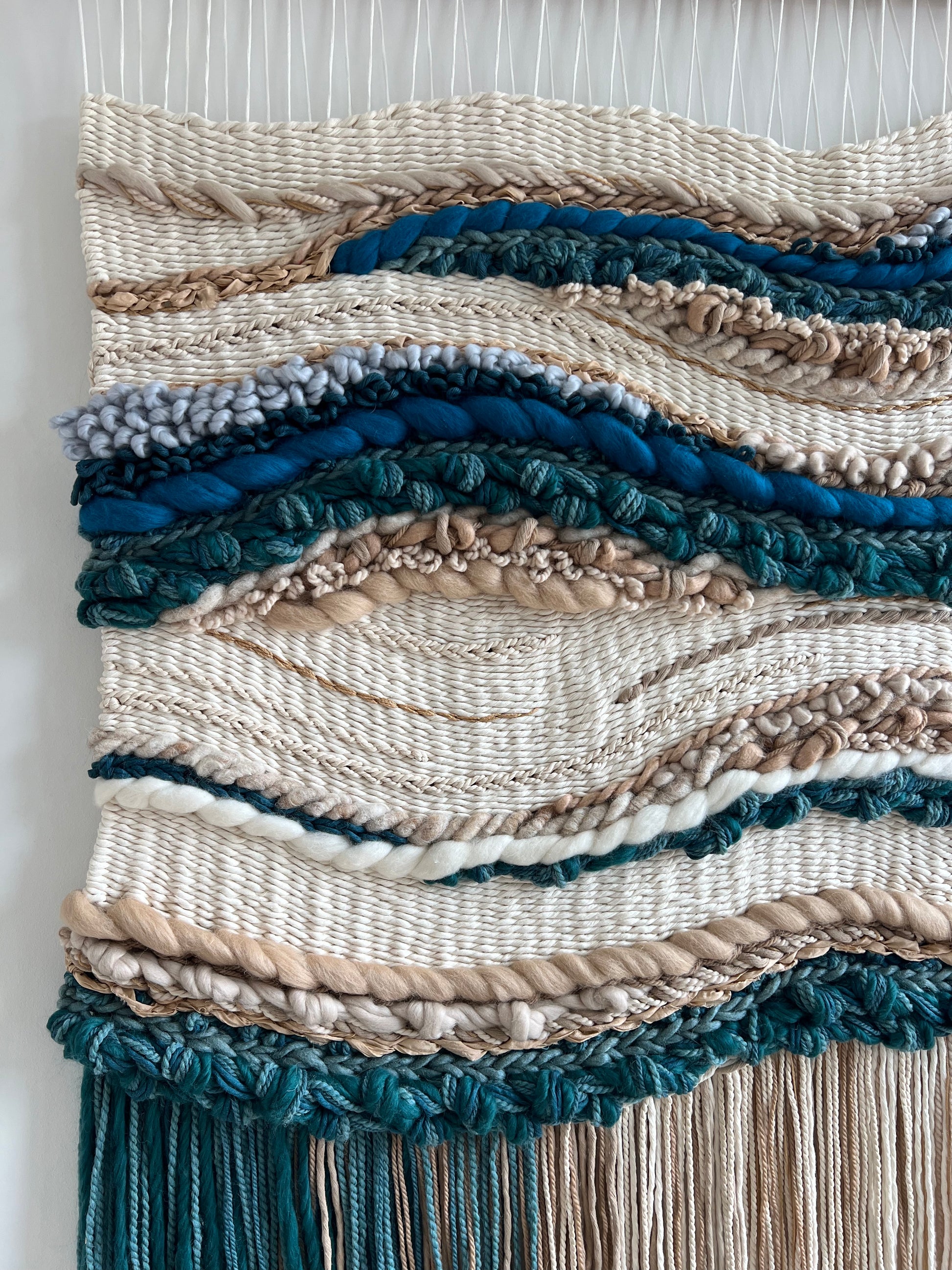 Macro shot of natural fibers and asymmetrical weaving in coastal wall tapestry