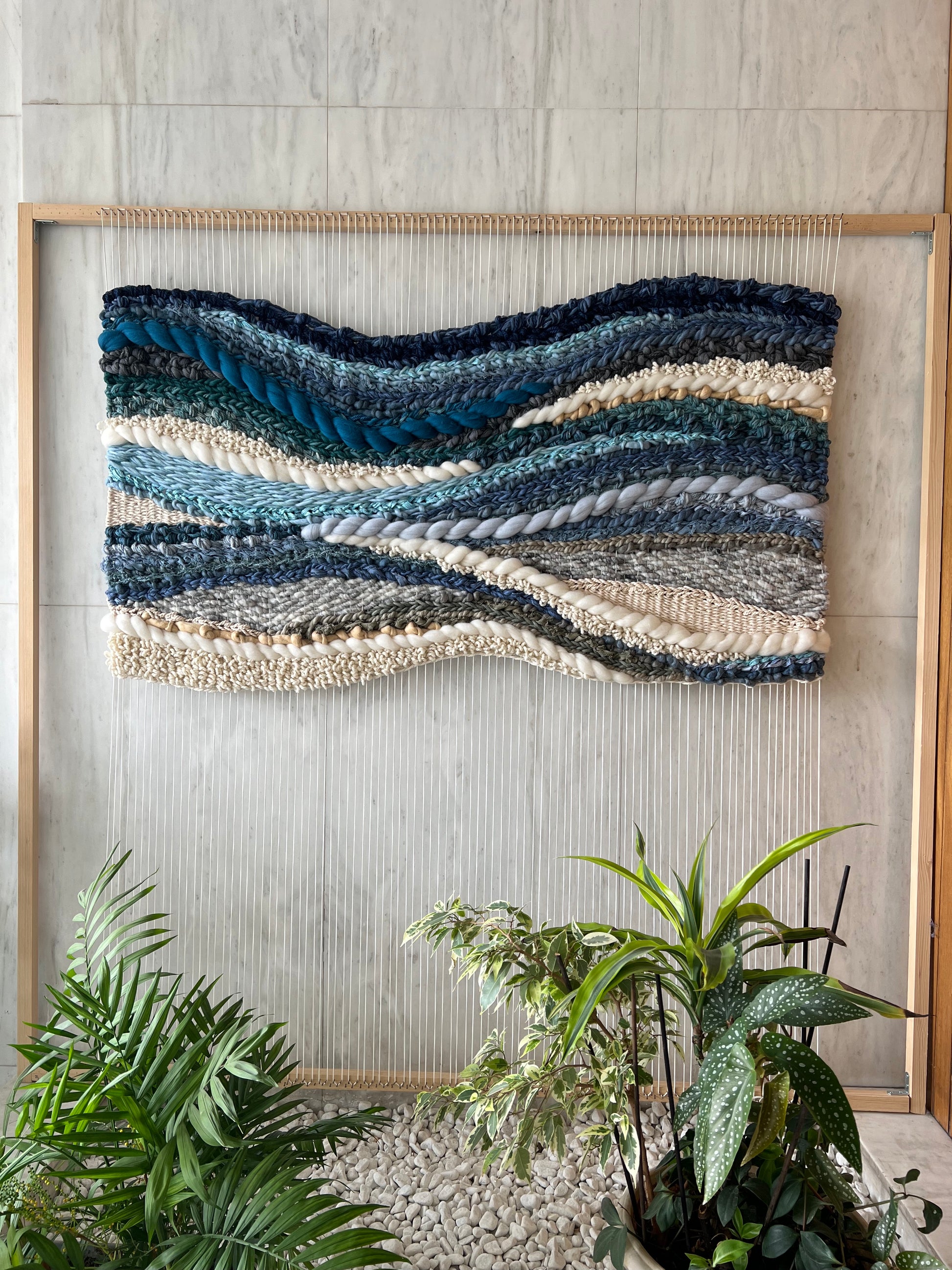 Handwoven wall art on the loom, wool tapestry with bold textured weaving